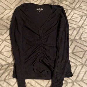A medium black hollister long sleeve shirt.